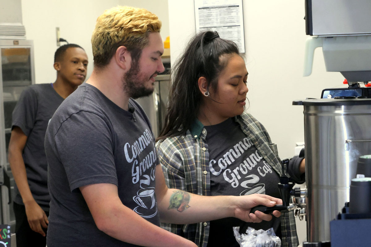 Intern Zackery Schultz being trained by Barista Kiana O’Connor Intern Zackery Schultz being trained by Barista Kiana O’Connor