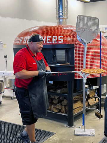 Jamaal Bradley with a wood-fired pizza