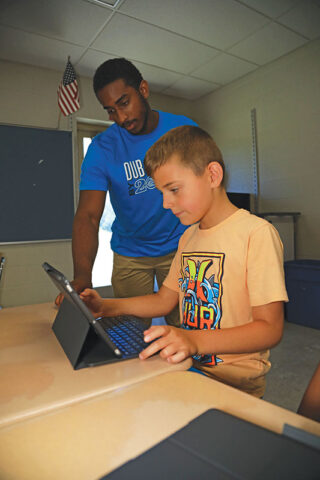Noah Higgs working with Robby Davis