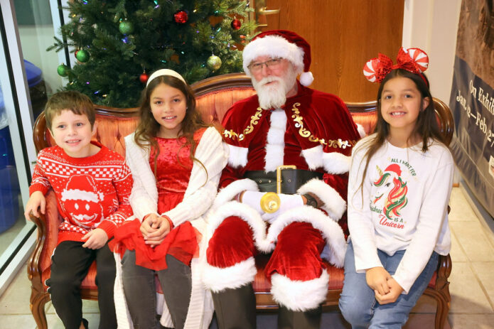 Santa asking the kids if they have been naughty or nice. (Mark Haynes, Clarksville Living Magazine)