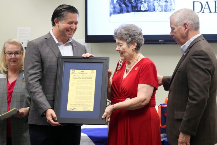 Mayors Golden and Pitts present DAR Chapter Regent Marie Tillman with a joint proclamation in honor of the Chapter's 110th Anniversary