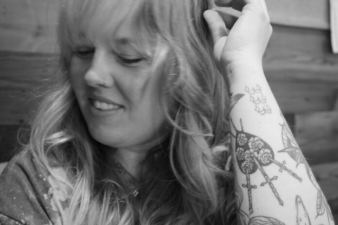 Hannah's tattoo from Verona, Italy, The Three of Sword. (D.C. Thomas, Clarksville Living Magazine)