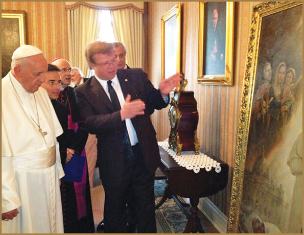 Official Portrait Unveiling, Igor Babailov shares with Pope Francis the painting’s symbolism. (Courtesy of Babailov)