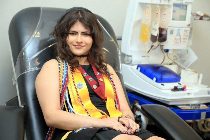 Rossview High School Class of 2025 graduate Toni Munoz about to donate blood at Blood Assurance. (Tony Centonze, Clarksville Living Magazine)