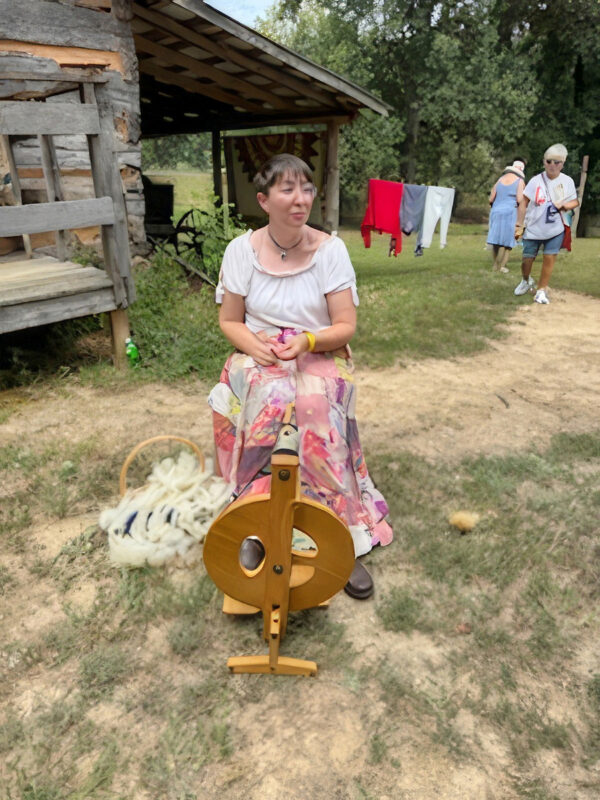 Aly Marvin demonstrating hand wool spinning Aly Marvin demonstrating hand wool spinning