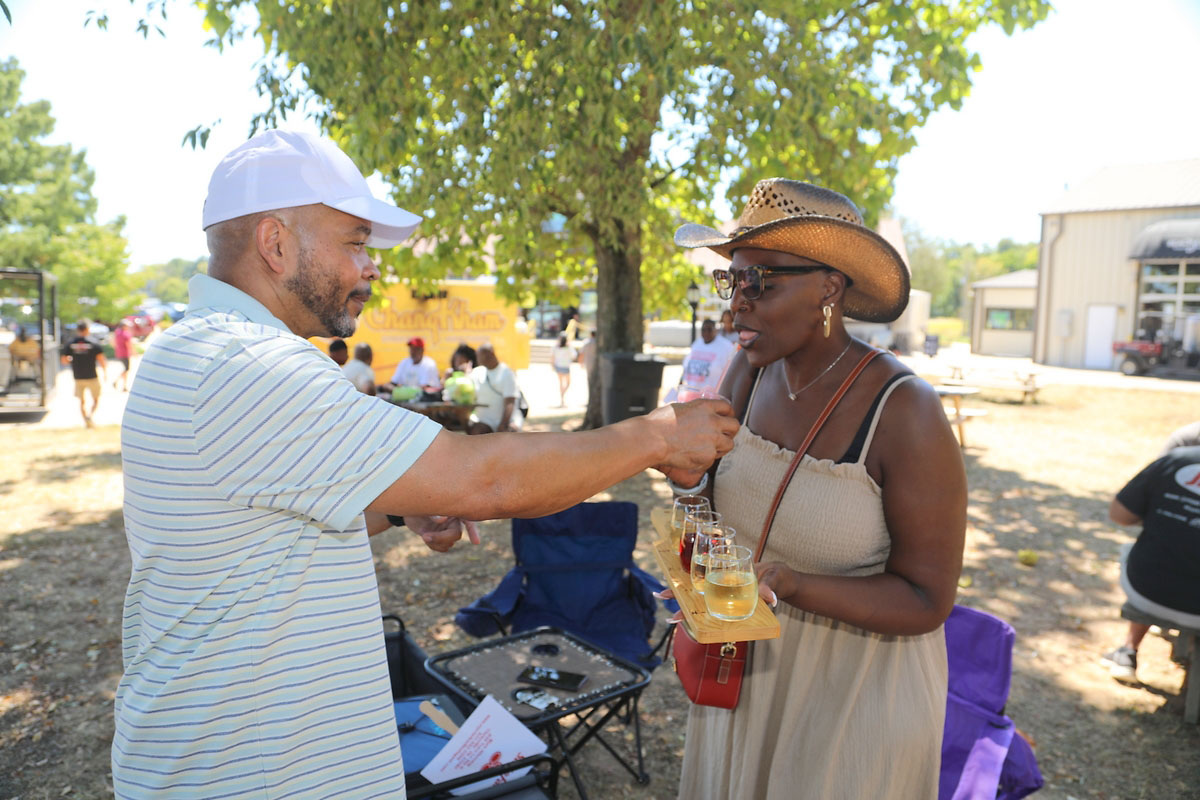 Kevin and LaBridgette Seymour sharing a flight of wines and a Golden Rose slushie at Beachaven during Harvest Fest Kevin and LaBridgette Seymour sharing a flight of wines and a Golden Rose slushie at Beachaven during Harvest Fest