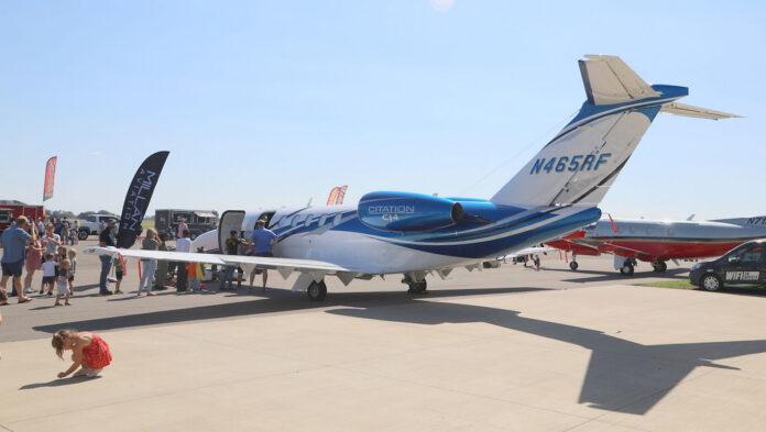 Families lined up to tour this Cessna Citation CJ4, a versatile, single-pilot-certified light business jet known for its speed and range