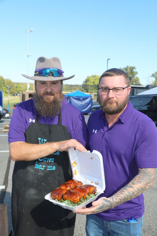 Matthew Farley and Bryan Pritchett of Clarksville team Novice Smoke about to turn in their chicken thighs