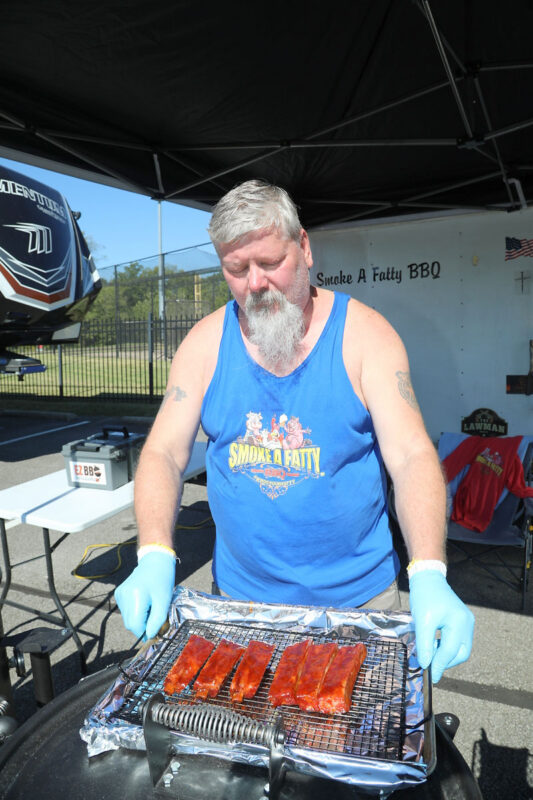 Nashville's Rick Neff of Smoke a Fatty BBQ showing off his ribs. Neff says its a tenderness game