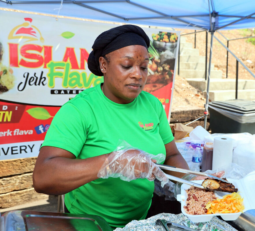 Diana Spencer of Island Jerk Flava jerk chicken rice and peas and cabbage. Diana Spencer of Island Jerk Flava jerk chicken rice and peas and cabbage.
