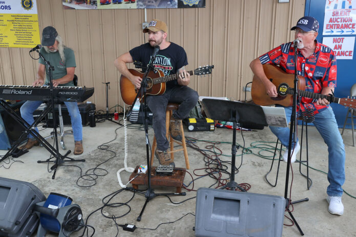 The Back Lot Pickers entertain the crowd with live bluegrass music during the 118th Annual Lone Oak Picnic in Cunningham. (Mark Haynes, Clarksville Living Magazine)
